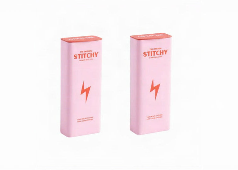 A tube of Grippy liquid body tape standing beside its carton.